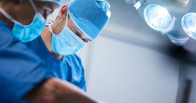 surgeons-performing-operation-operation-room