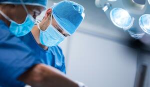 surgeons-performing-operation-operation-room