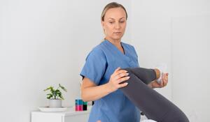 physiotherapist-helping-young-female-patient-her-c