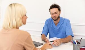 close-up-pacient-talking-doctor-about-vaccine