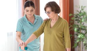 medium-shot-old-woman-holding-dumbbell
