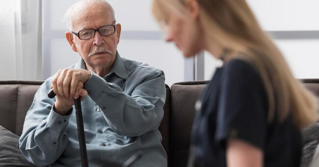 old-man-being-consulted-by-nurse (1)