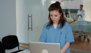 medical-assistant-working-with-computer-help-docto