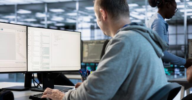it-engineer-looking-pc-screen-working-network-secu