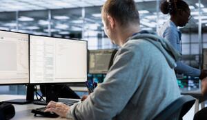 it-engineer-looking-pc-screen-working-network-secu